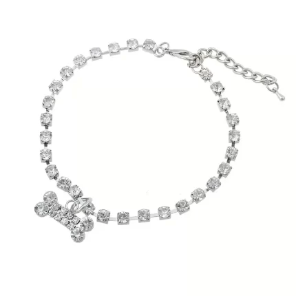 Gargantilla de strass color rosa c/dije de huesito.Talle L