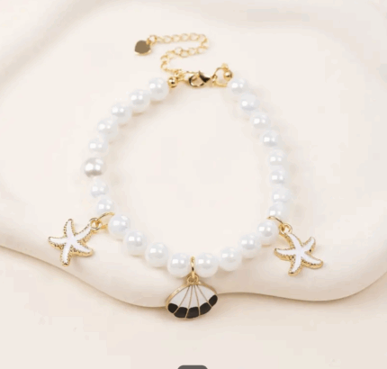 Collar de perlas c/dijes de ostras.Talle L