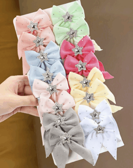 Moños c/clip. Motivo de estrella.Varios colores