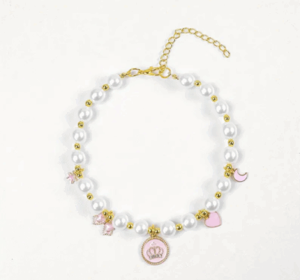 Collar de perlas c/dijes rosas. Talle L